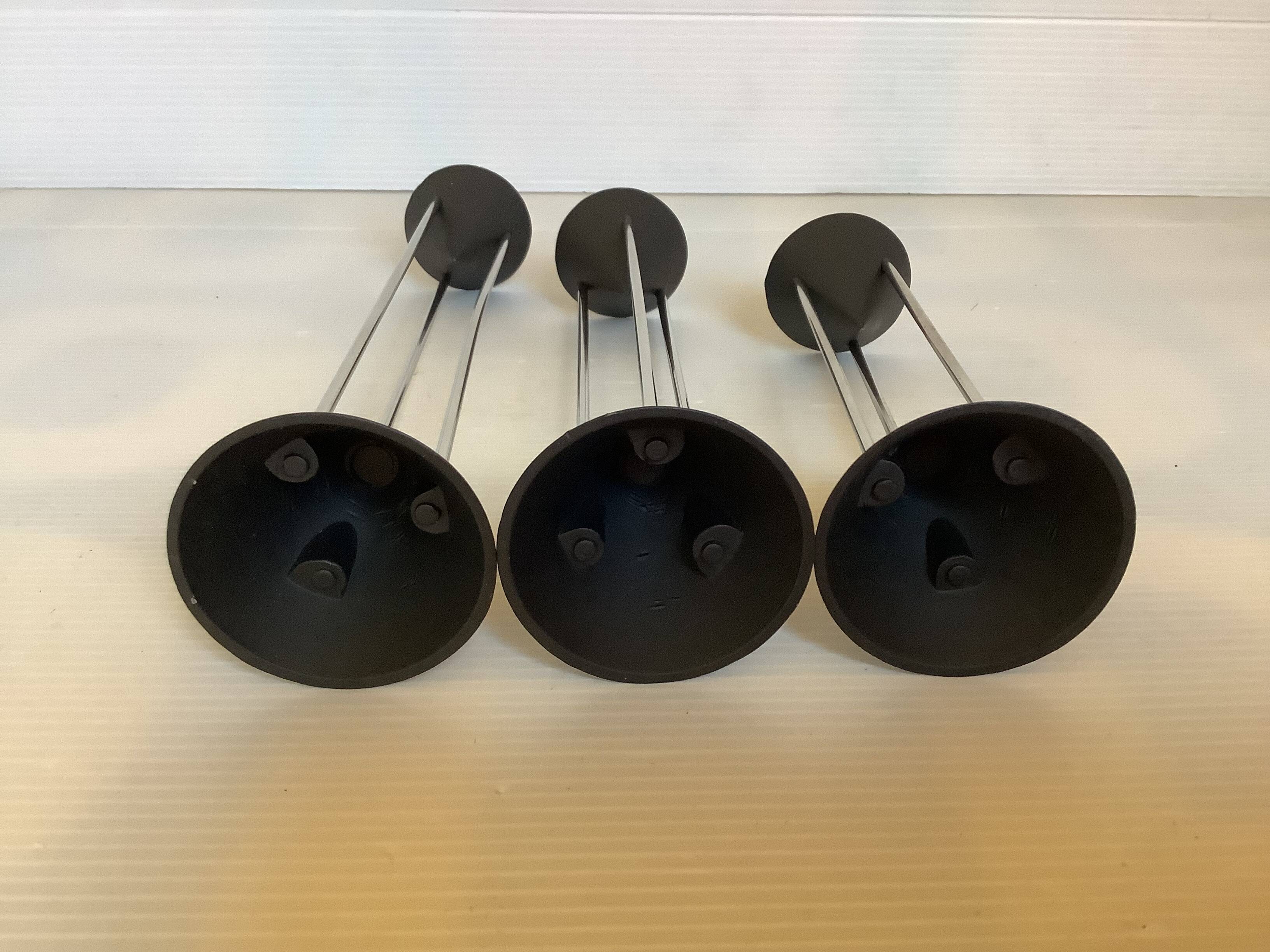 Vintage black candlestick trio