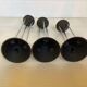 Vintage black candlestick trio