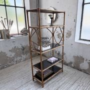 Rattan bookshelf and black glasses