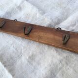 Wall hook from wood and brass