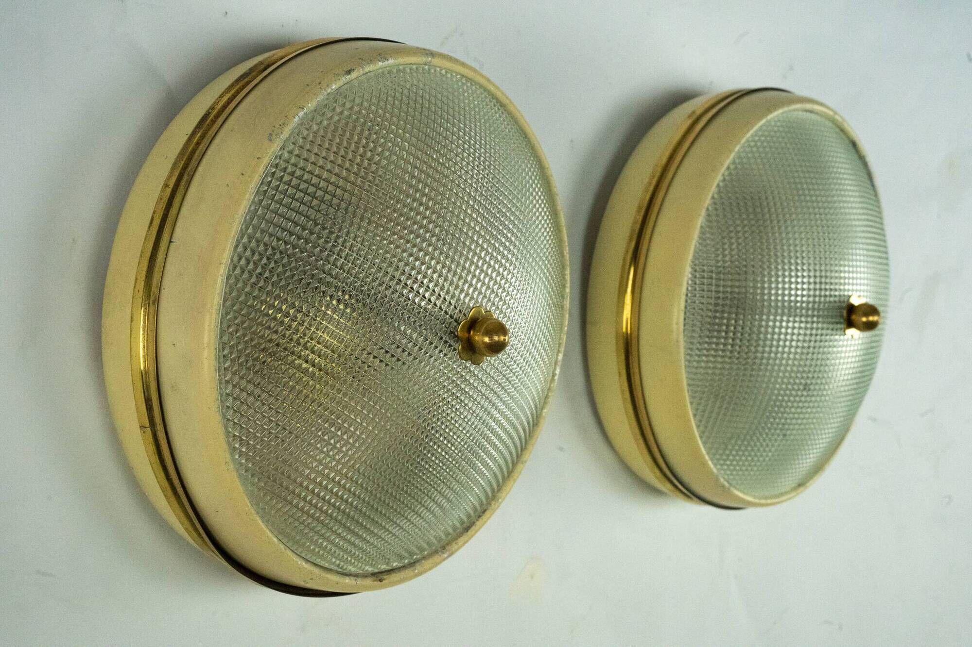 Lumi Milano, pair of wall or ceiling lamps in glass, brass and lacquer, 50s