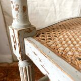 19th-century corner fireplace armchair, wood and cane.