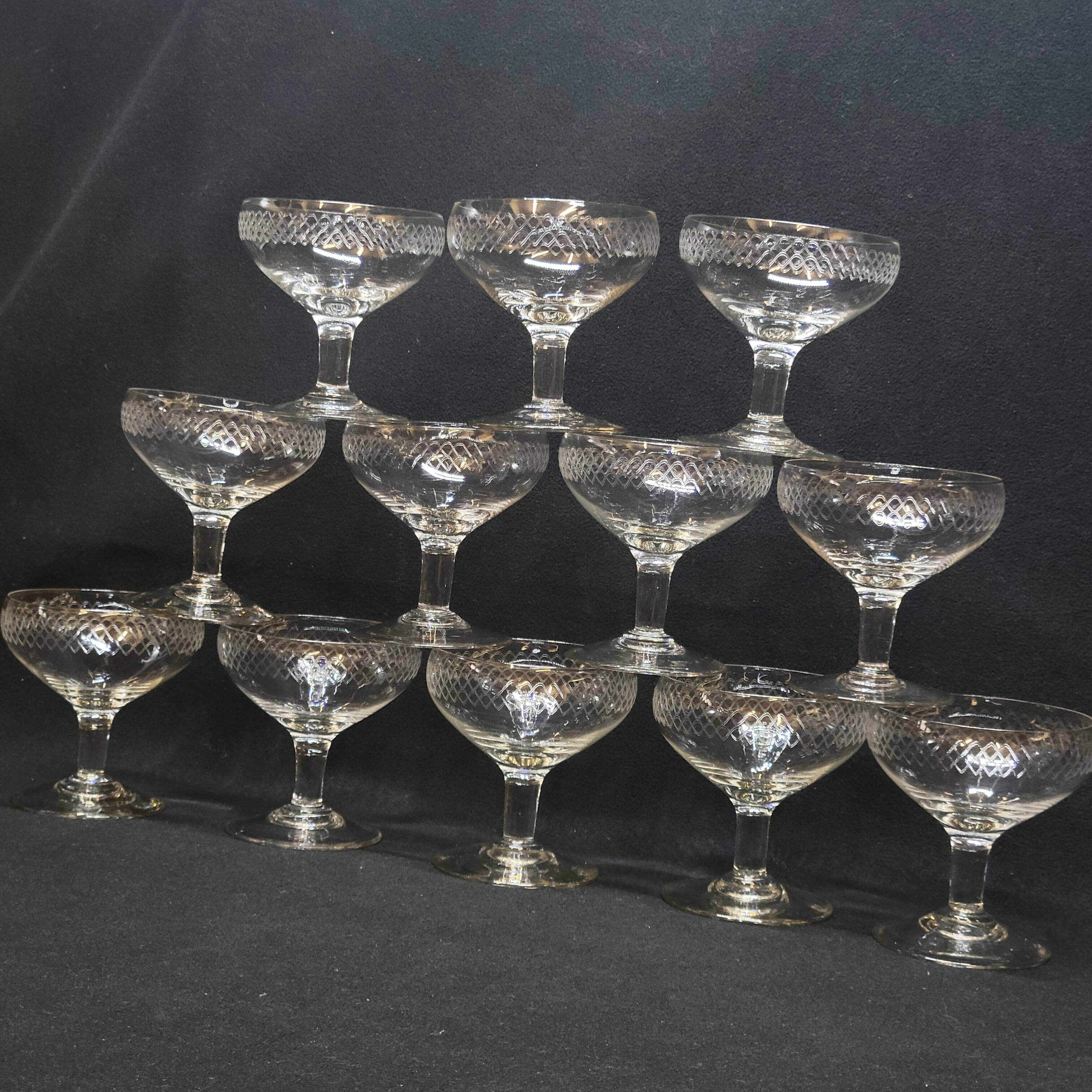 12 old champagne glasses in blown and engraved glass