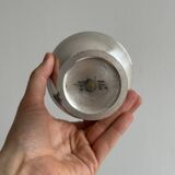 Silver-plated metal bowl on a stand