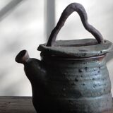 Homemade teapot in pyrity sandstone