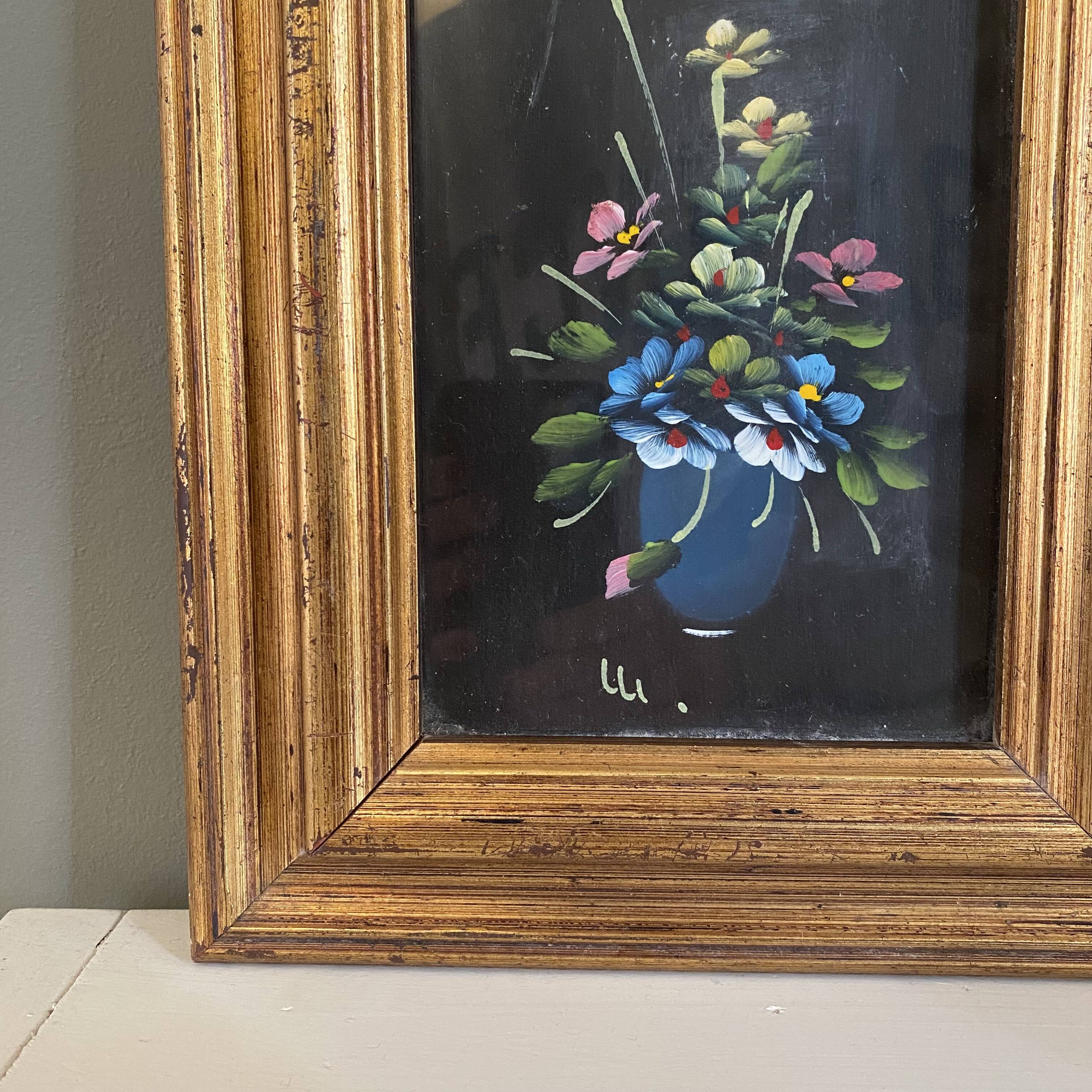 Golden frame with painting bouquet of flowers