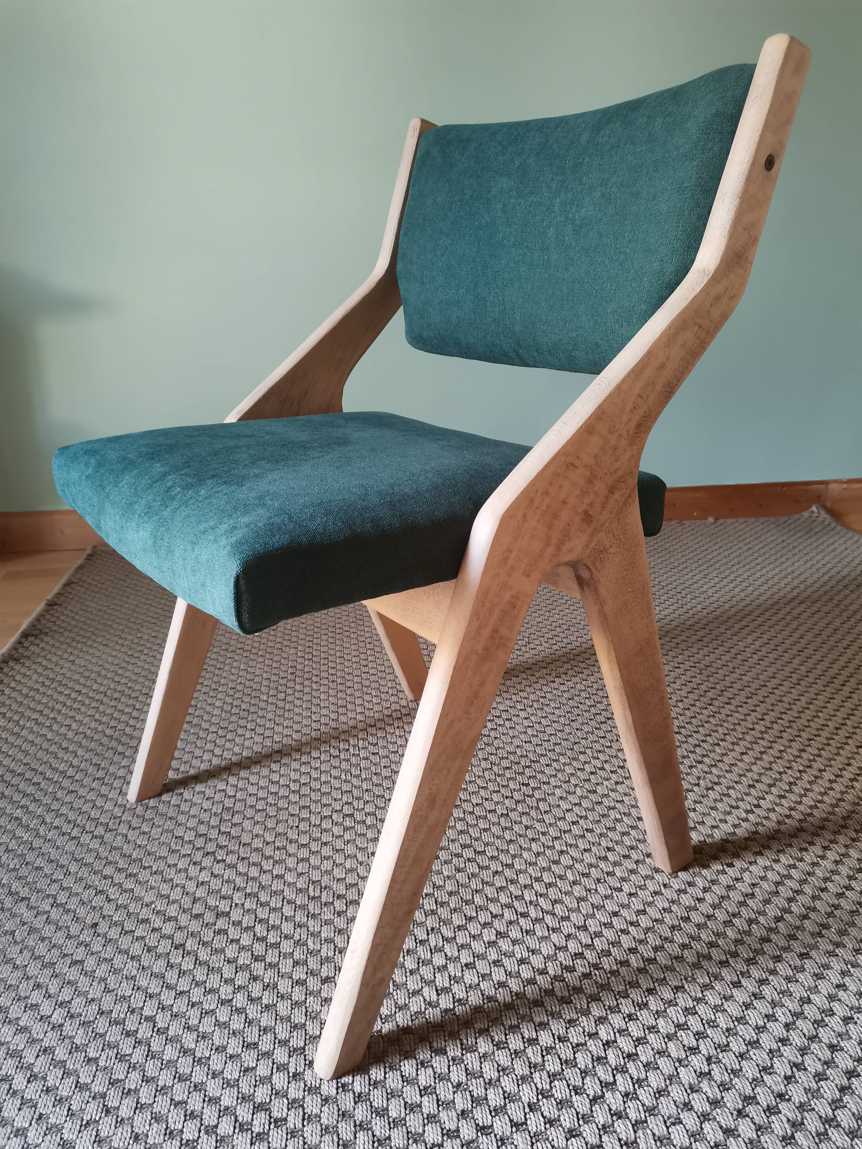 Scandinavian green chairs with tapered legs.