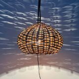 Mid-century modern Danish extendable cantilever wall lamp with a rattan shade, 1960s.
