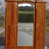 Louis XVI armoire with marquetry and gilded bronze