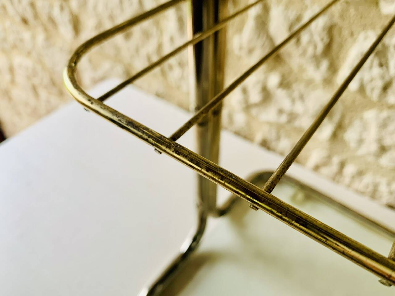 Glass and brass side table with magazine rack, circa 1970's