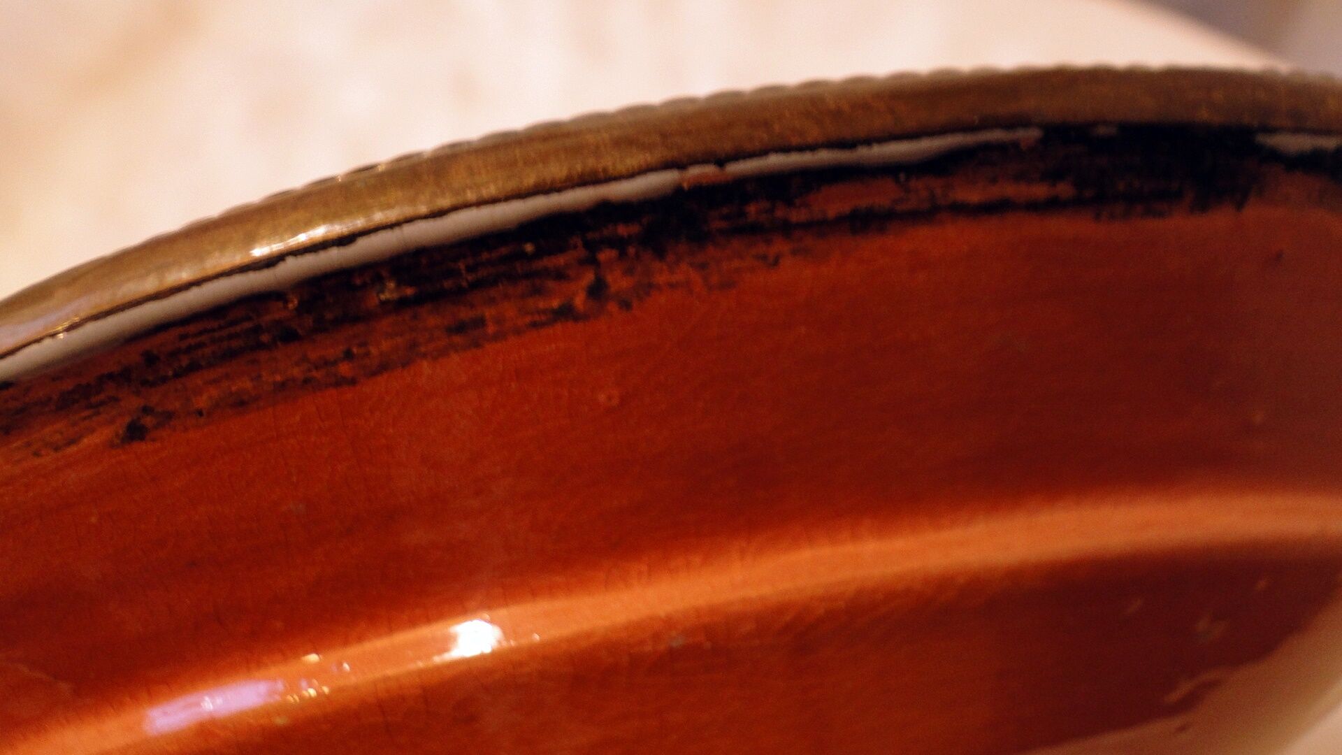 Hollow glazed terracotta dish with oriental decor to hang