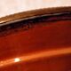 Hollow glazed terracotta dish with oriental decor to hang