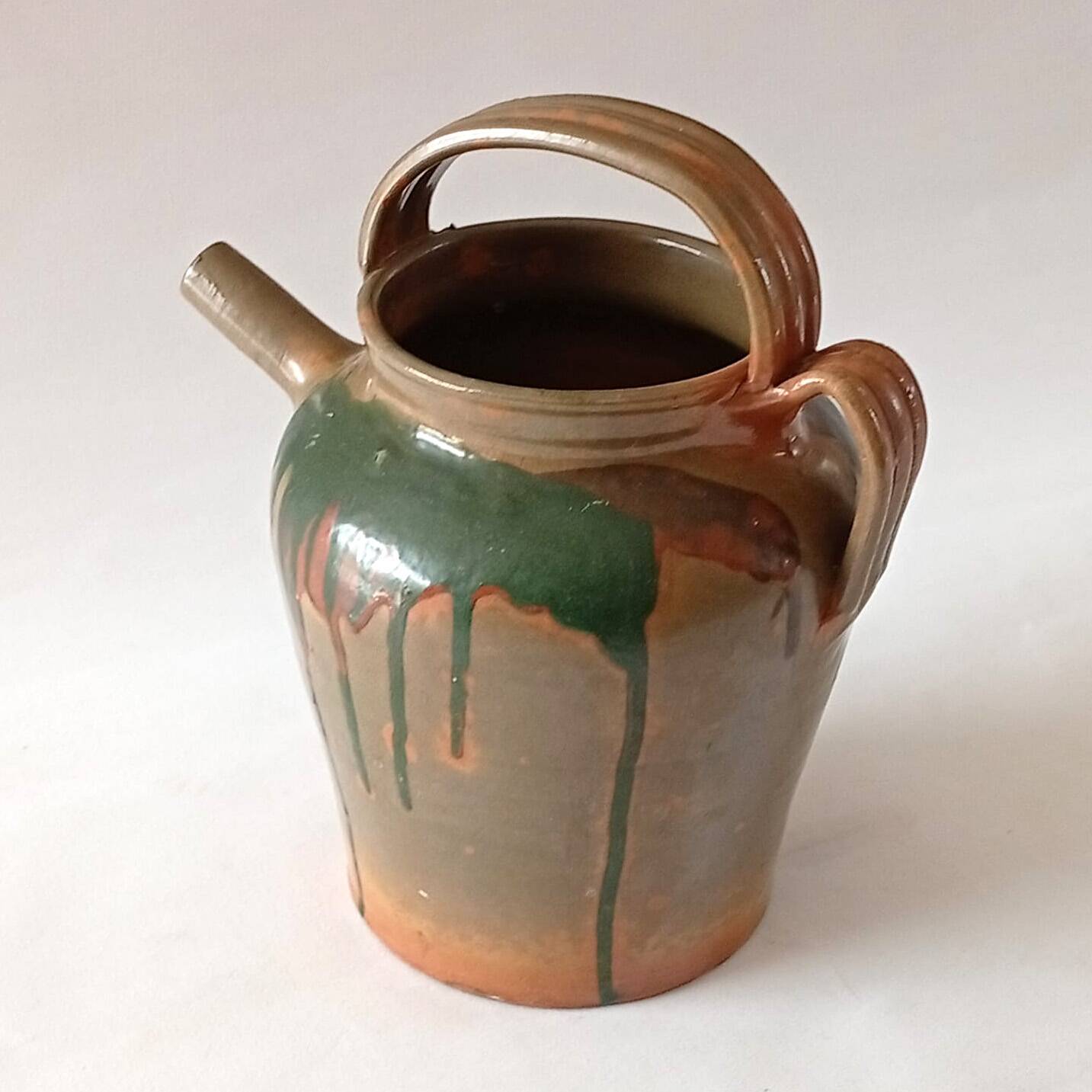 Glazed stoneware jug with drips