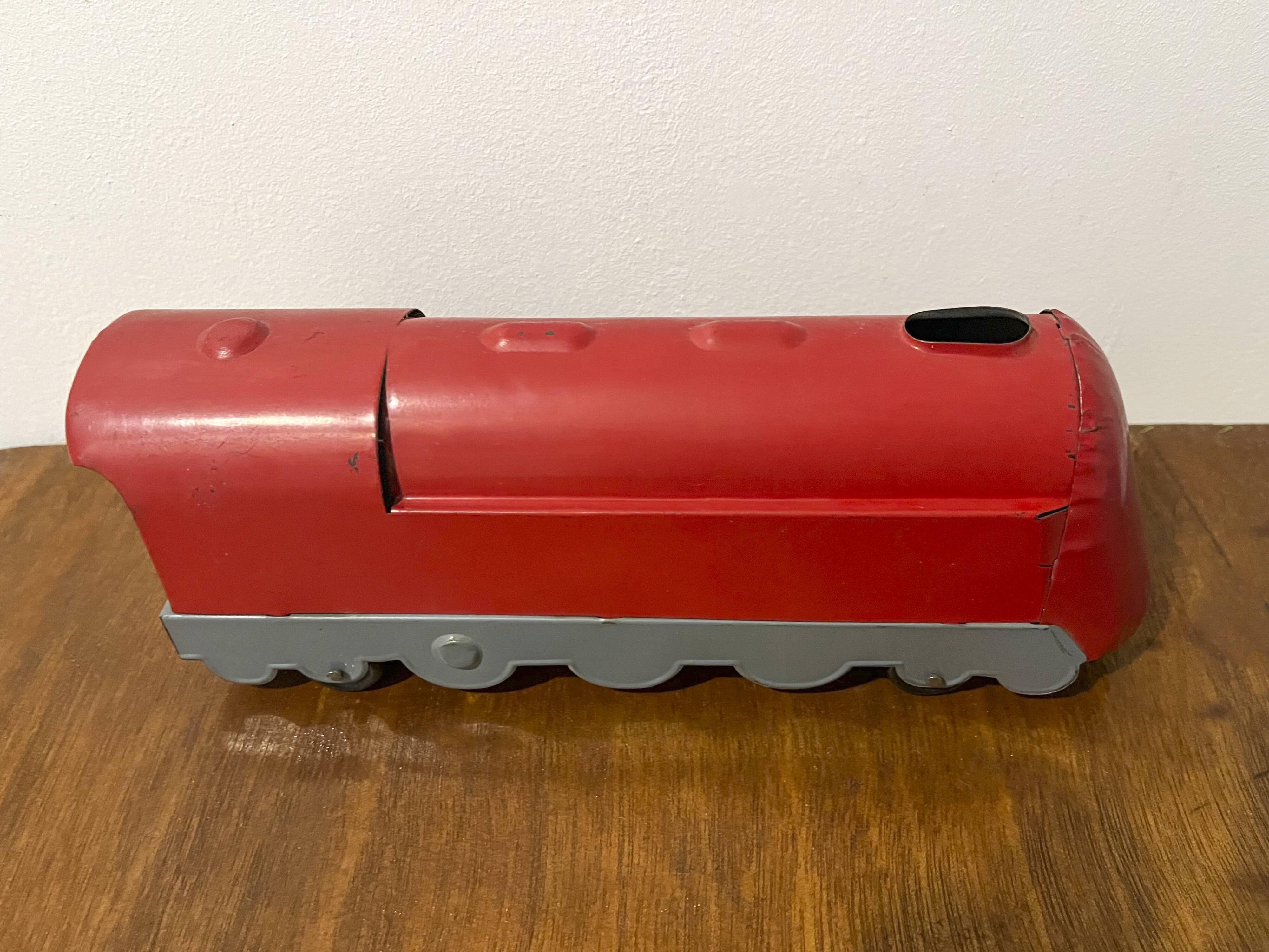 Red sheet metal locomotive 60s