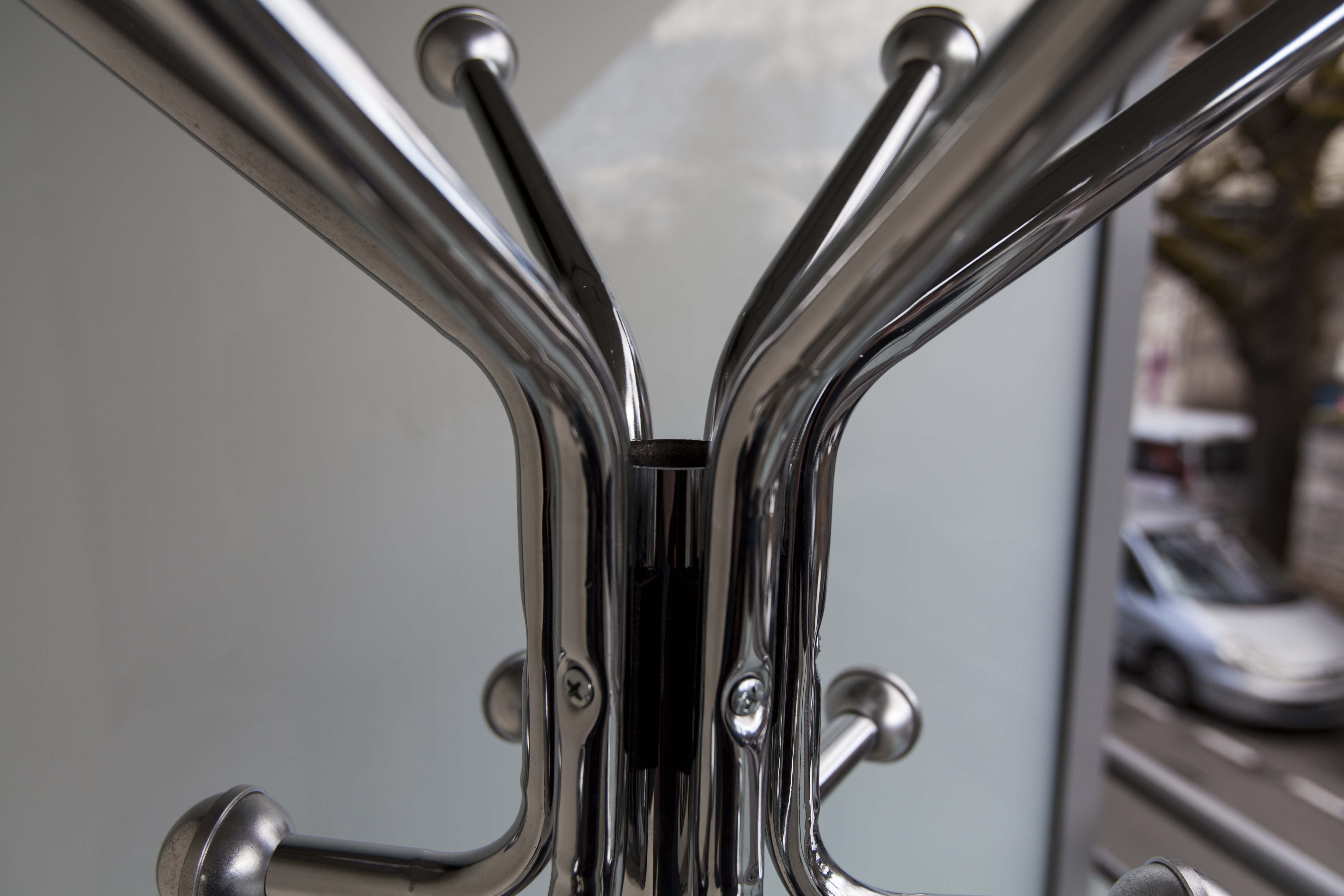 Chrome metal parrot coat holder from the 70s