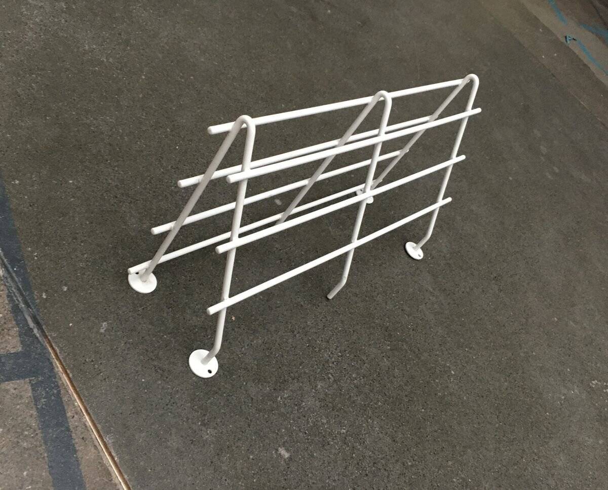 Mid-century modern minimalist metal coat rack from the 1960s.
