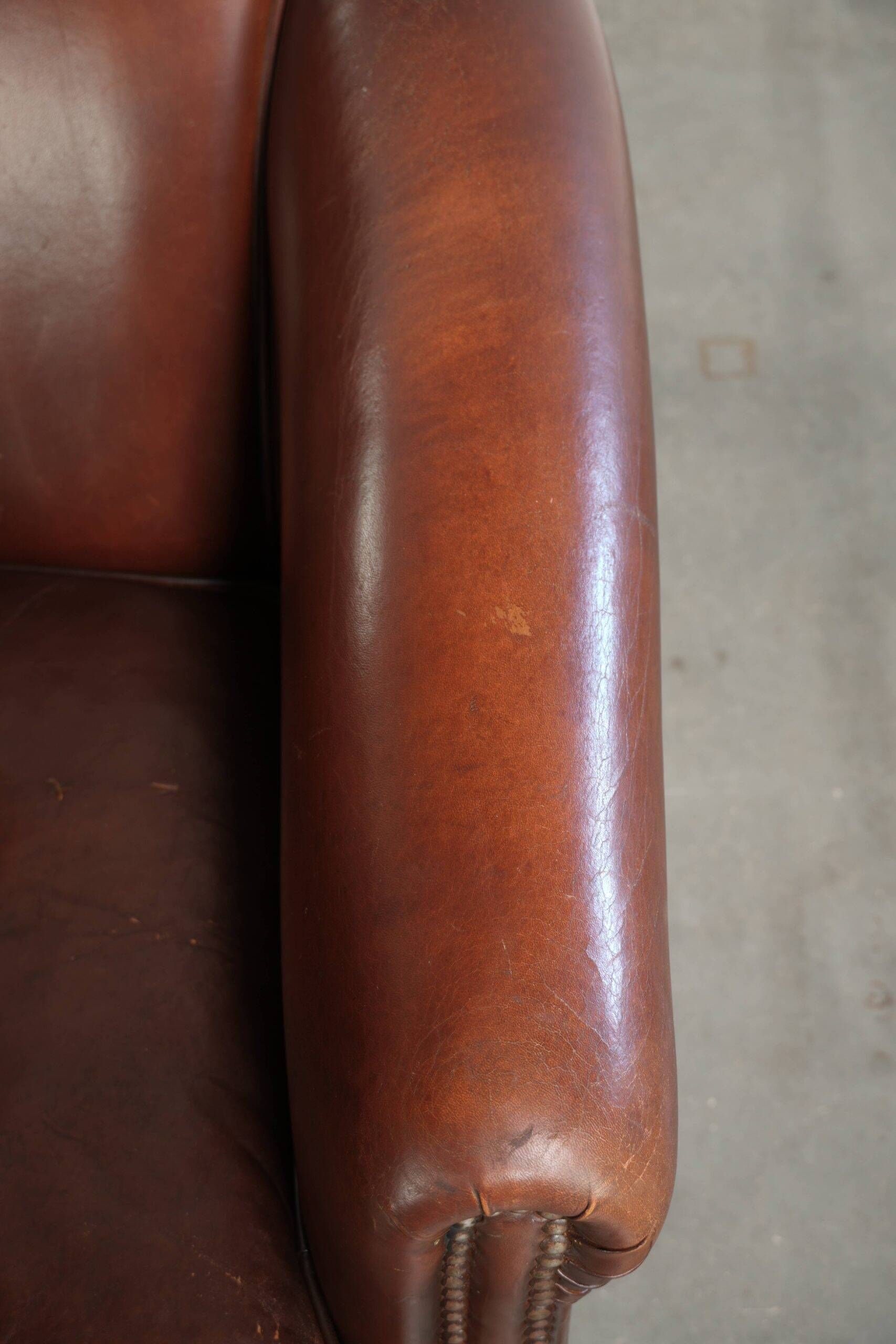 Sheepskin club armchair in English style with brown colour scheme