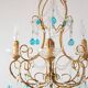 Italian chandelier in gold metal and blue crystal drops