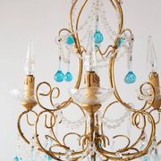 Italian chandelier in gold metal and blue crystal drops