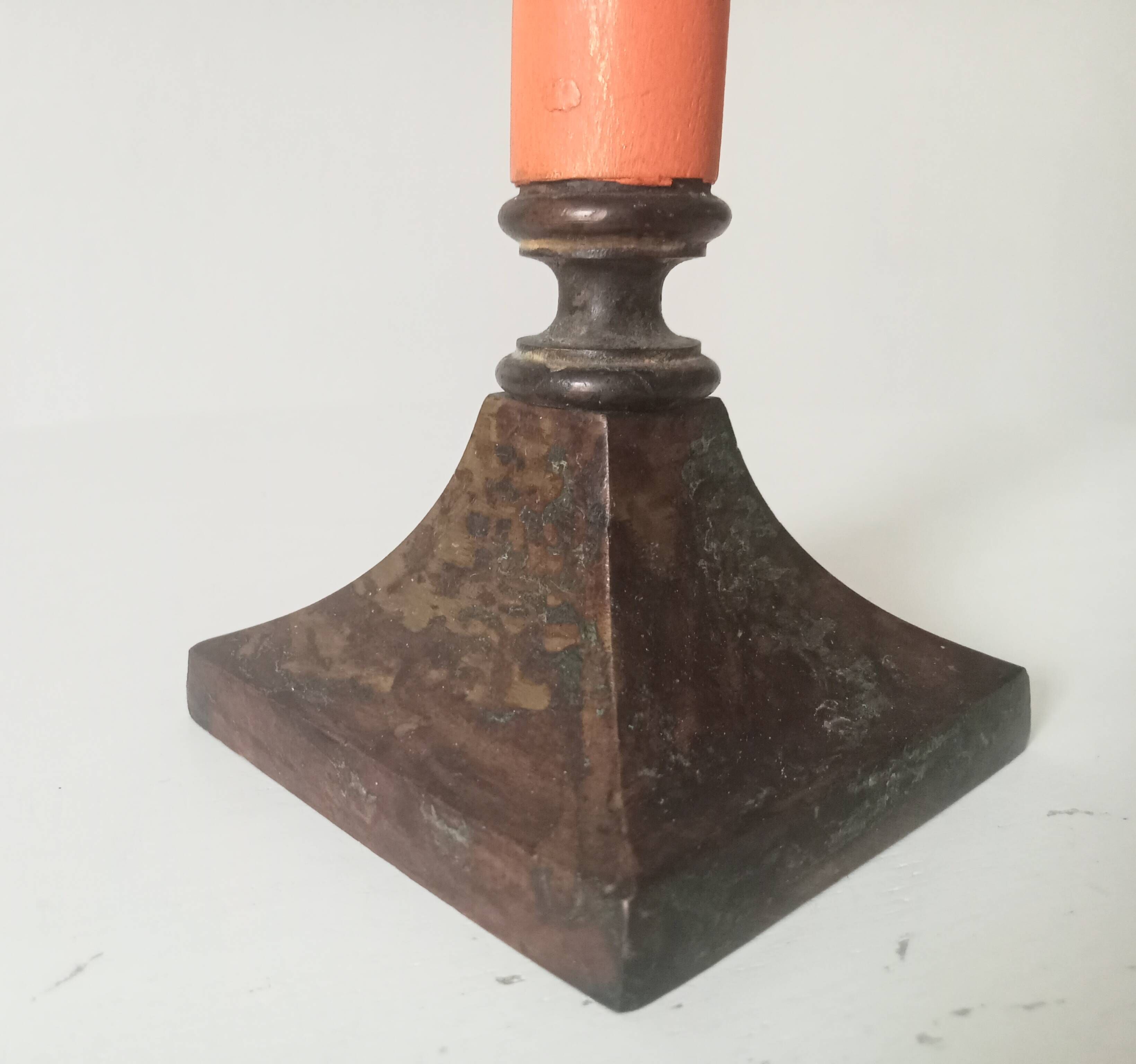 Vintage candlestick in solid gilded brass and orange wood.