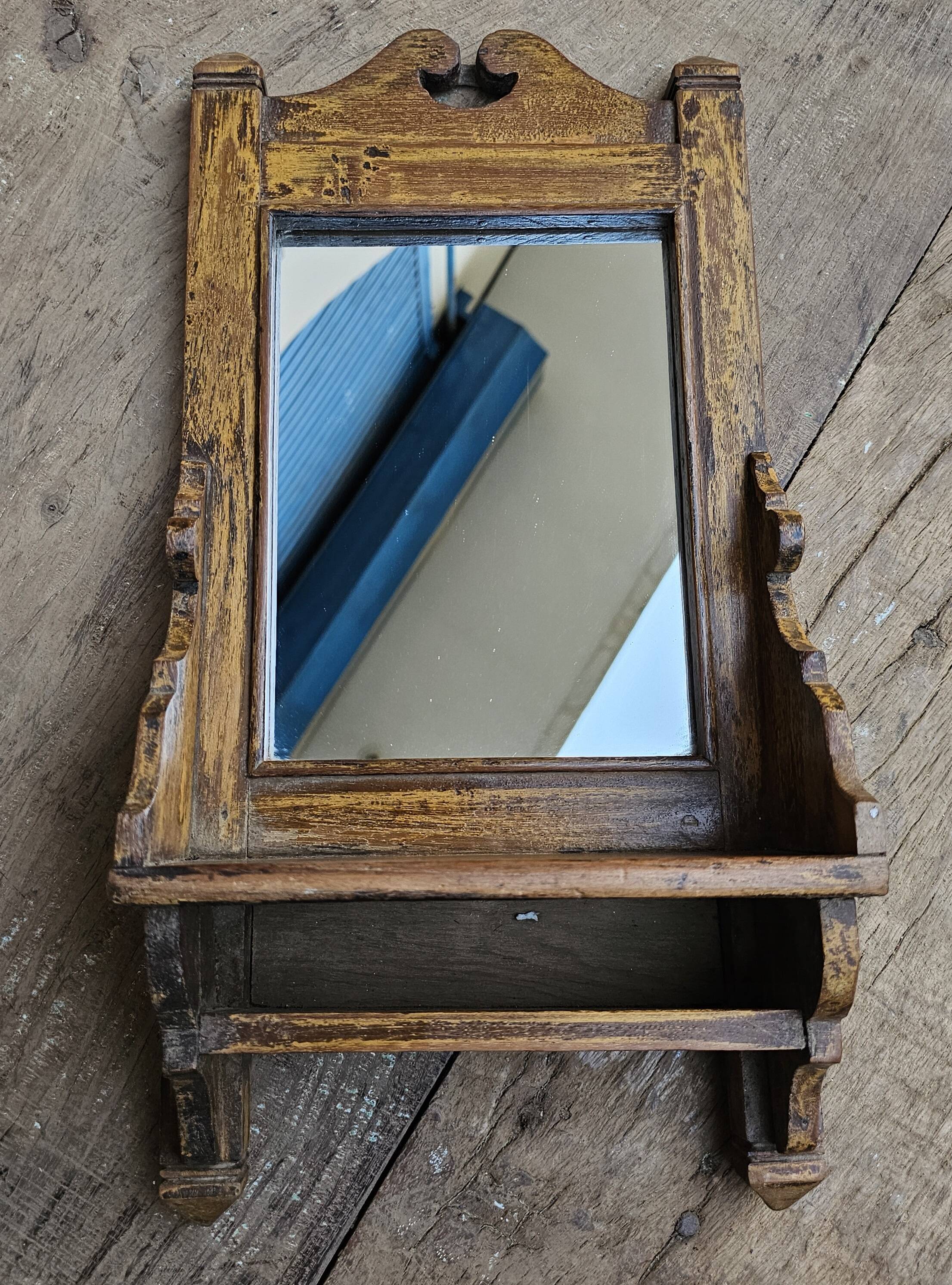 Antique barber's mirror in Burmese teak.