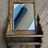Antique barber's mirror in Burmese teak.