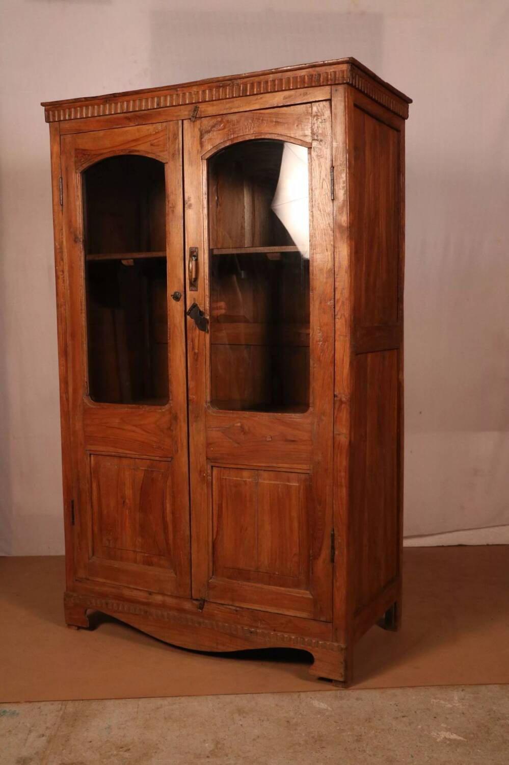 Antique Art Deco display cabinet in Burmese teak.
