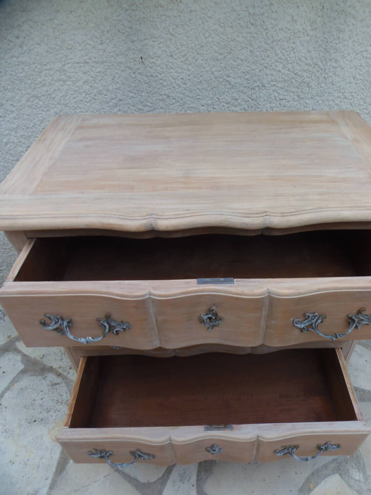 Beautifully crafted Louis XVI style commode in bleached wood.