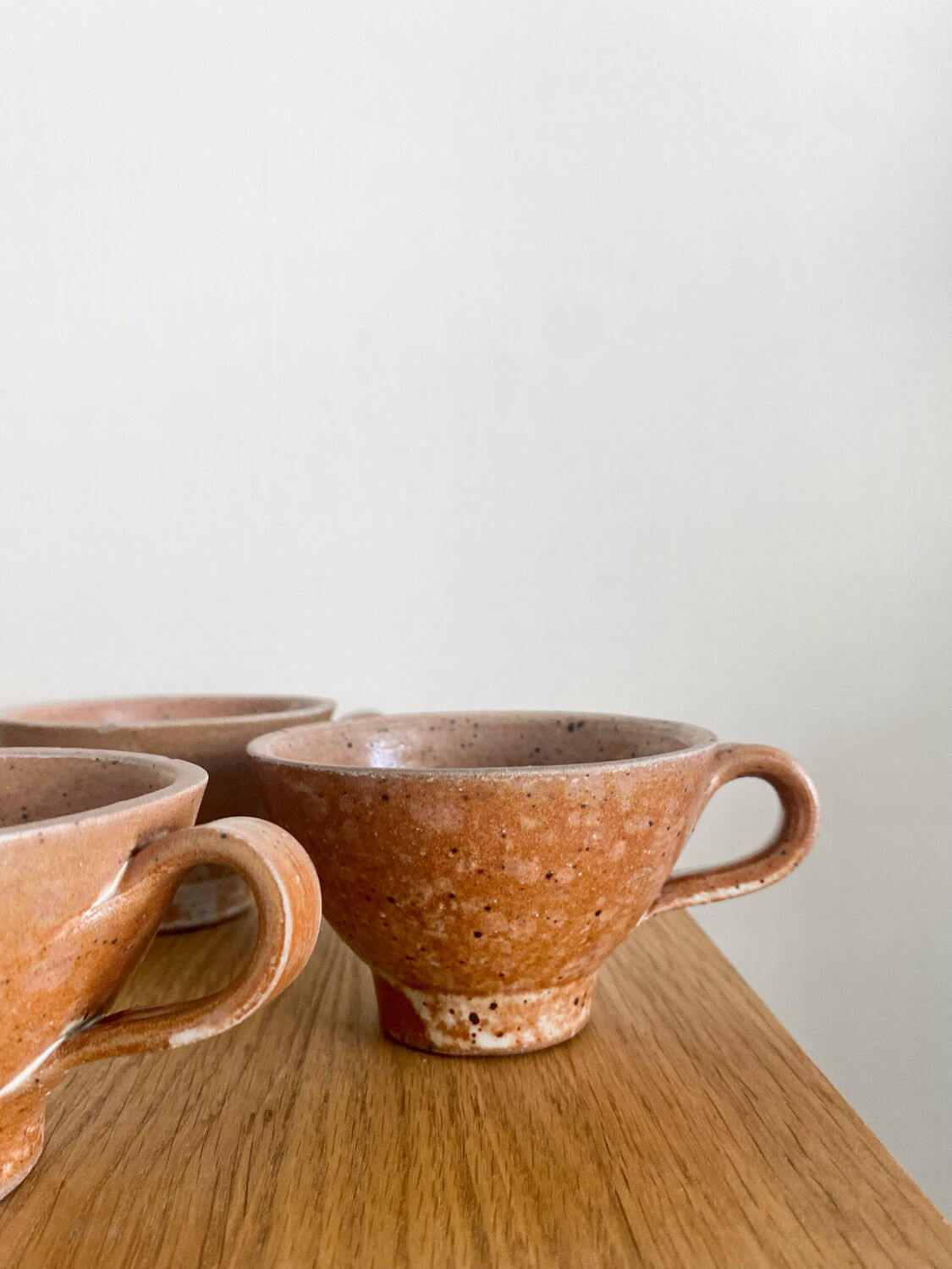 Three antique stoneware cups
