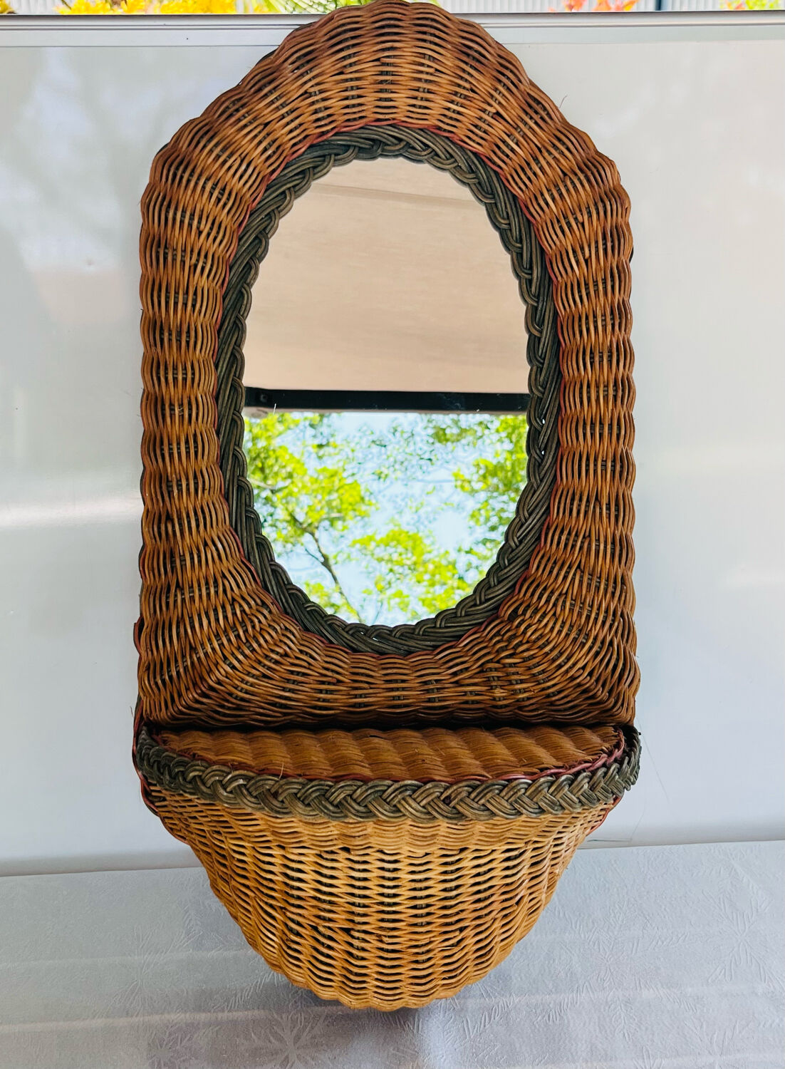 Oval wicker mirror