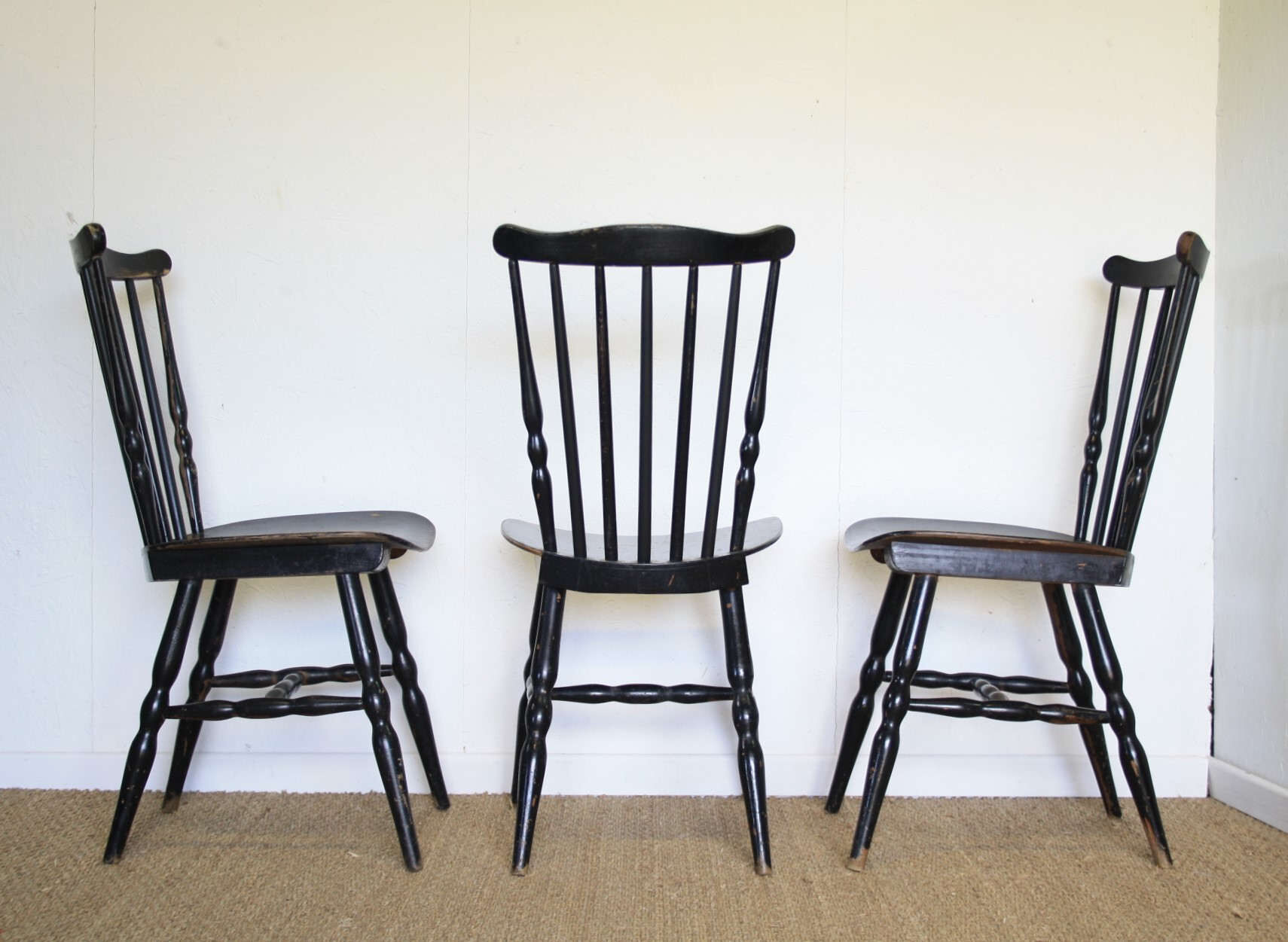 Three black Baumann bistro chairs