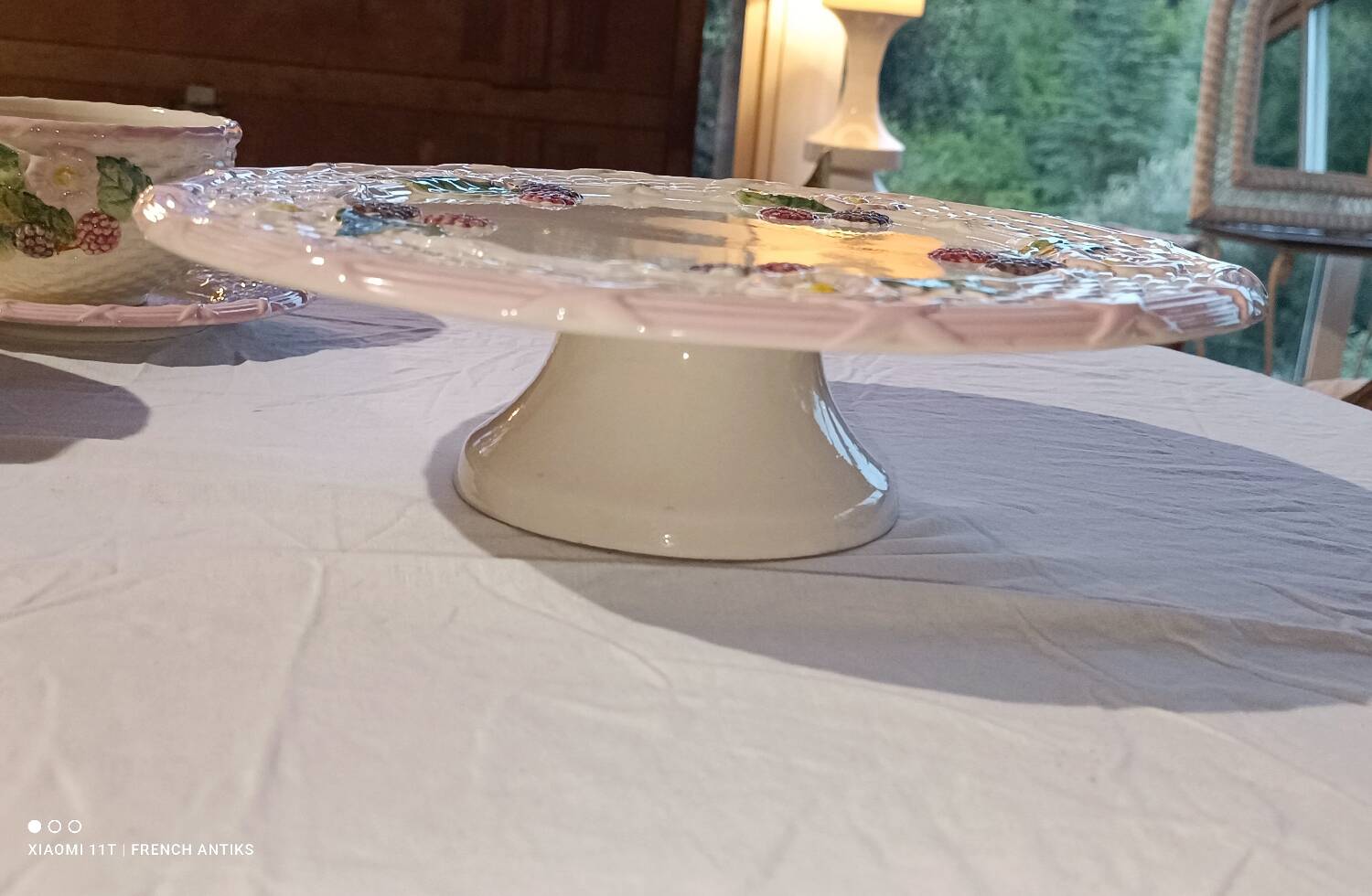 Footed dessert plate in barbotine porcelain, marked FG.