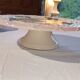 Footed dessert plate in barbotine porcelain, marked FG.