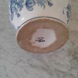 Blue vase adorned with blue and white