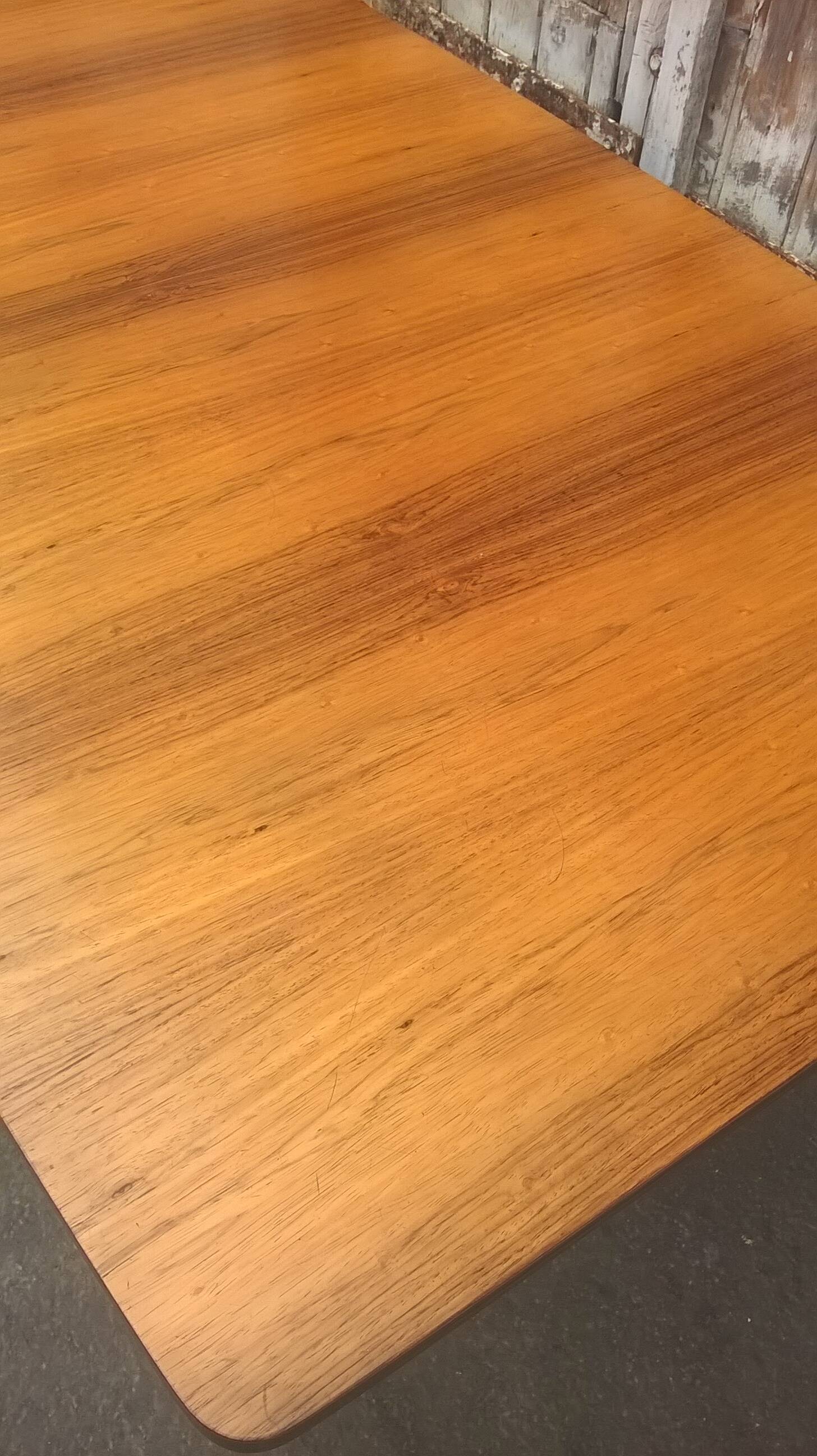 Extendable teak dining table