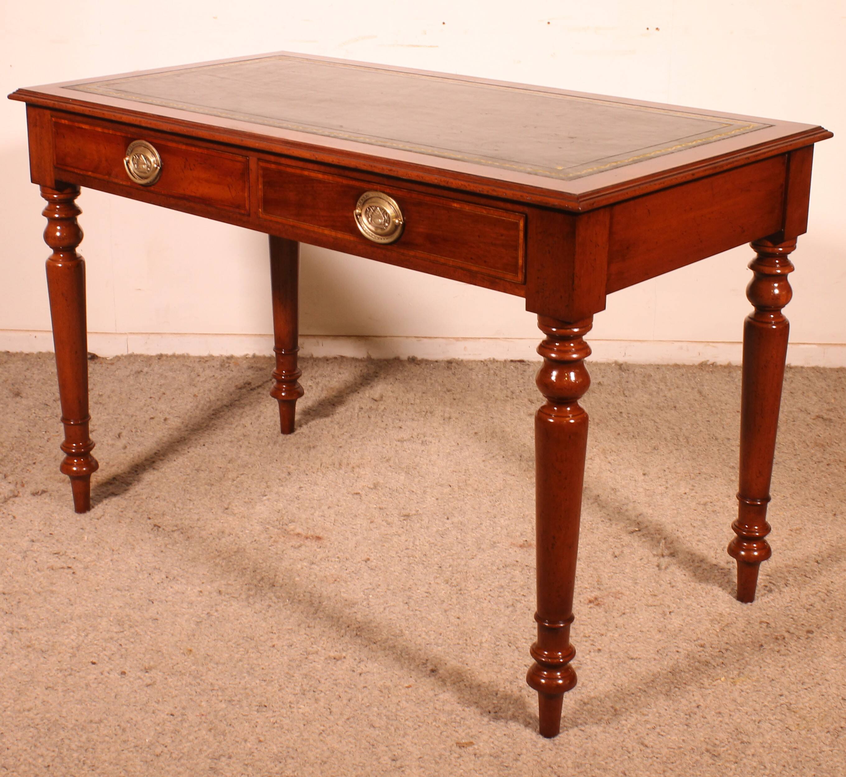 flat desk with two drawers from the 19th century in mahogany and inlays