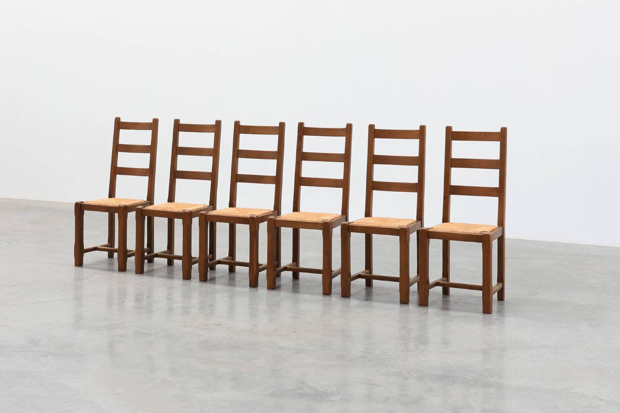 Set of 6 rustic oak ladder-back chairs with rush seats, France, 20th centur