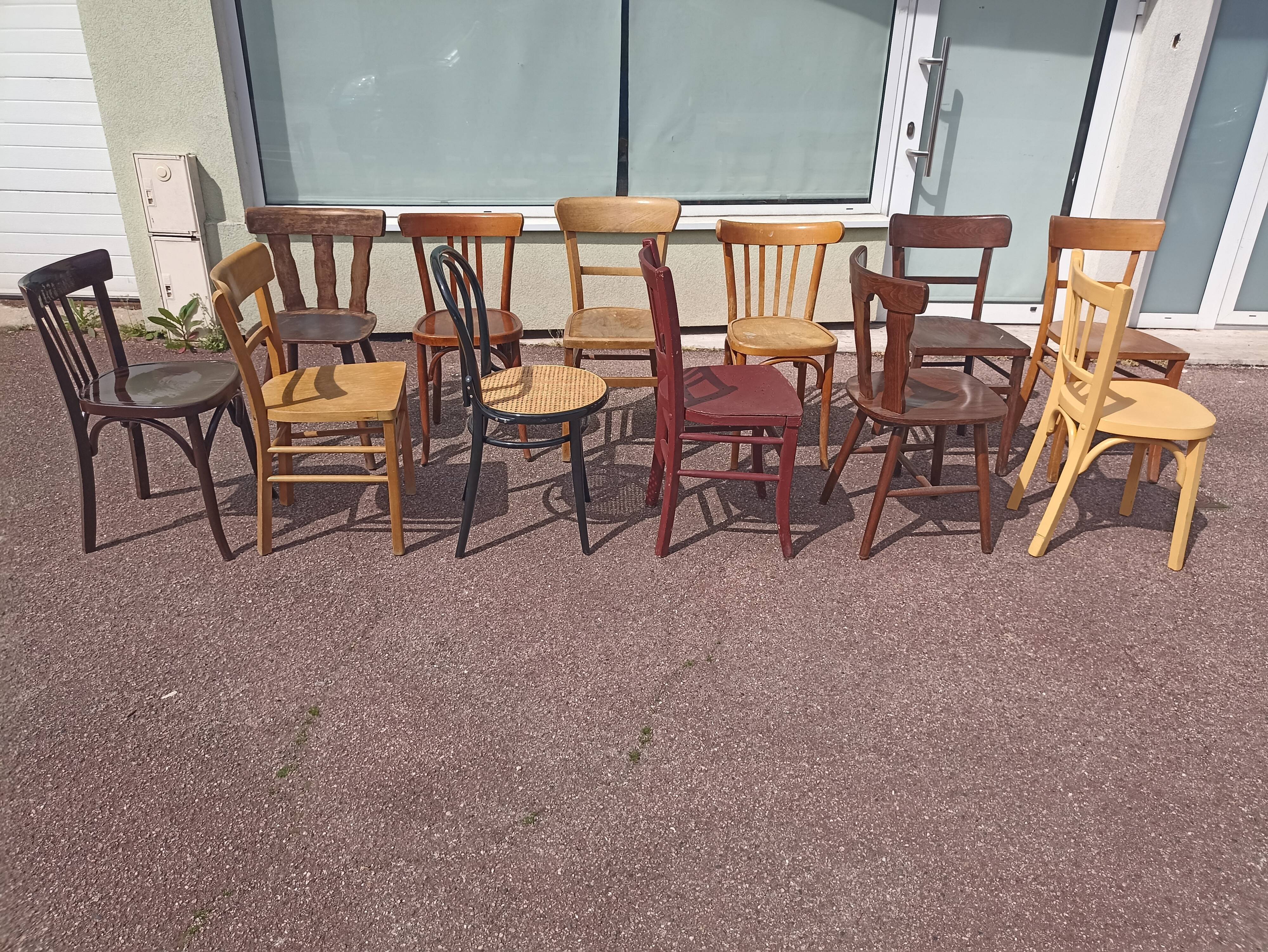 Set of 12 mismatched wooden bistro chairs