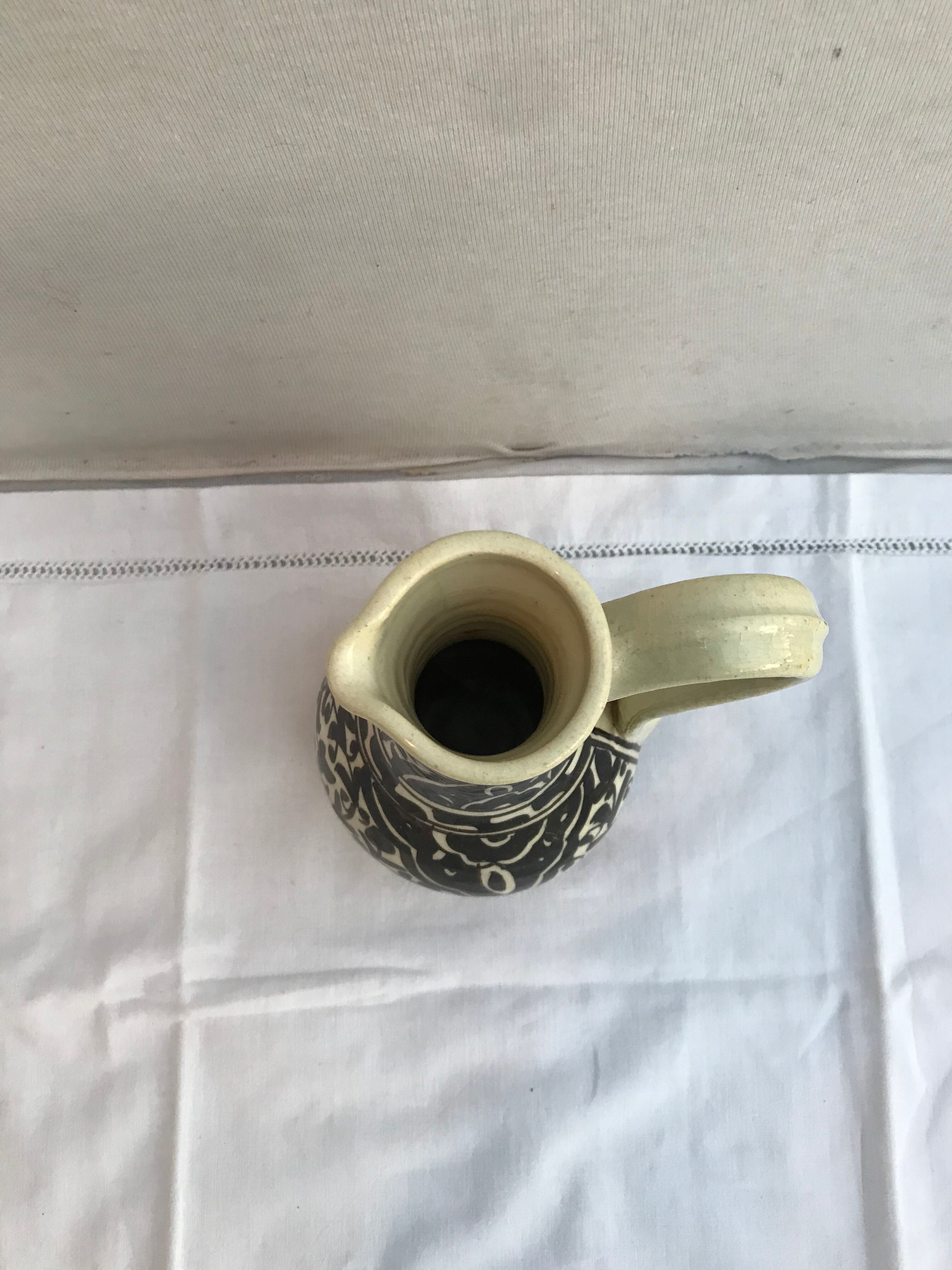 Former beige cracked ceramic pitcher