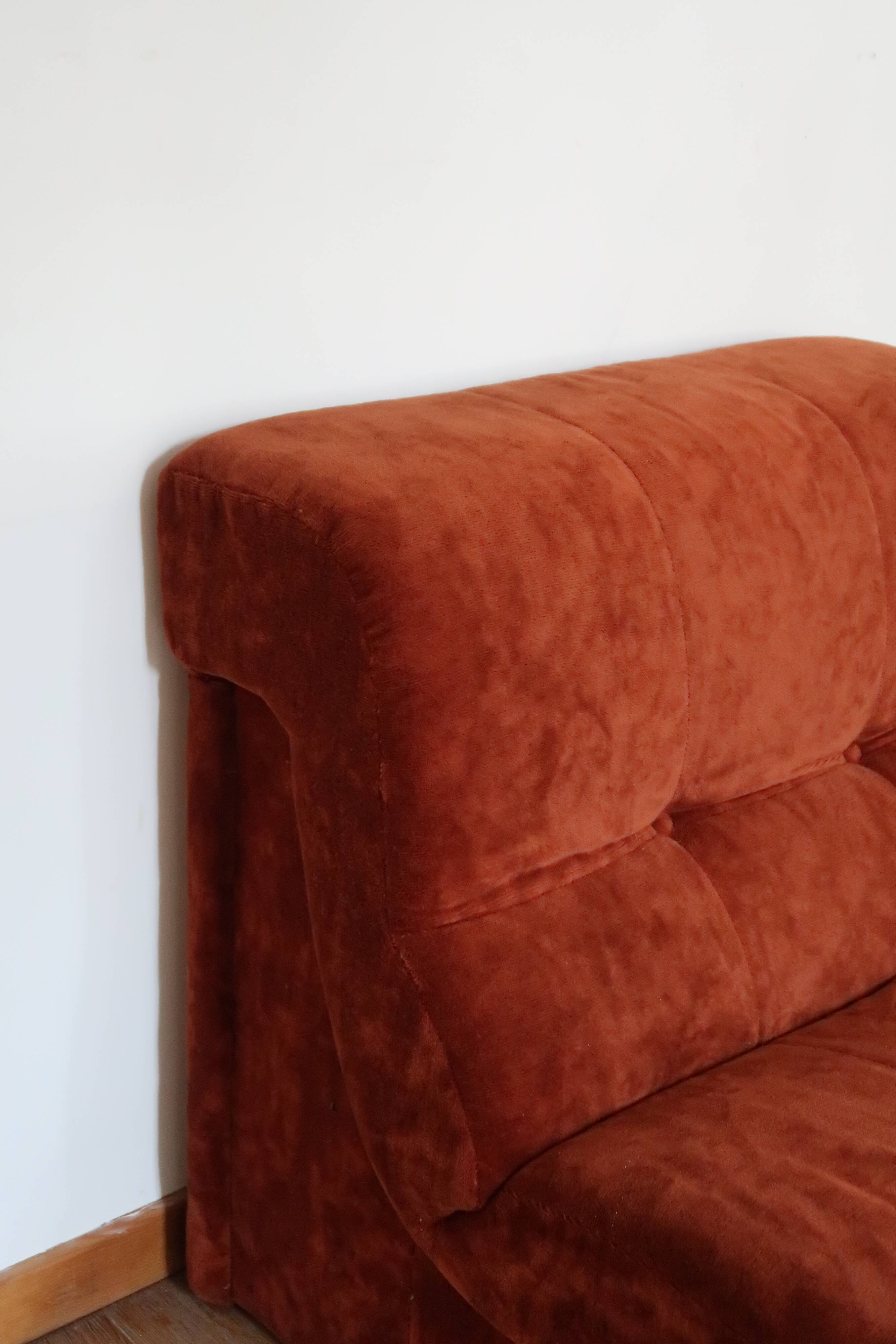 Rusty velvet low chair without arms