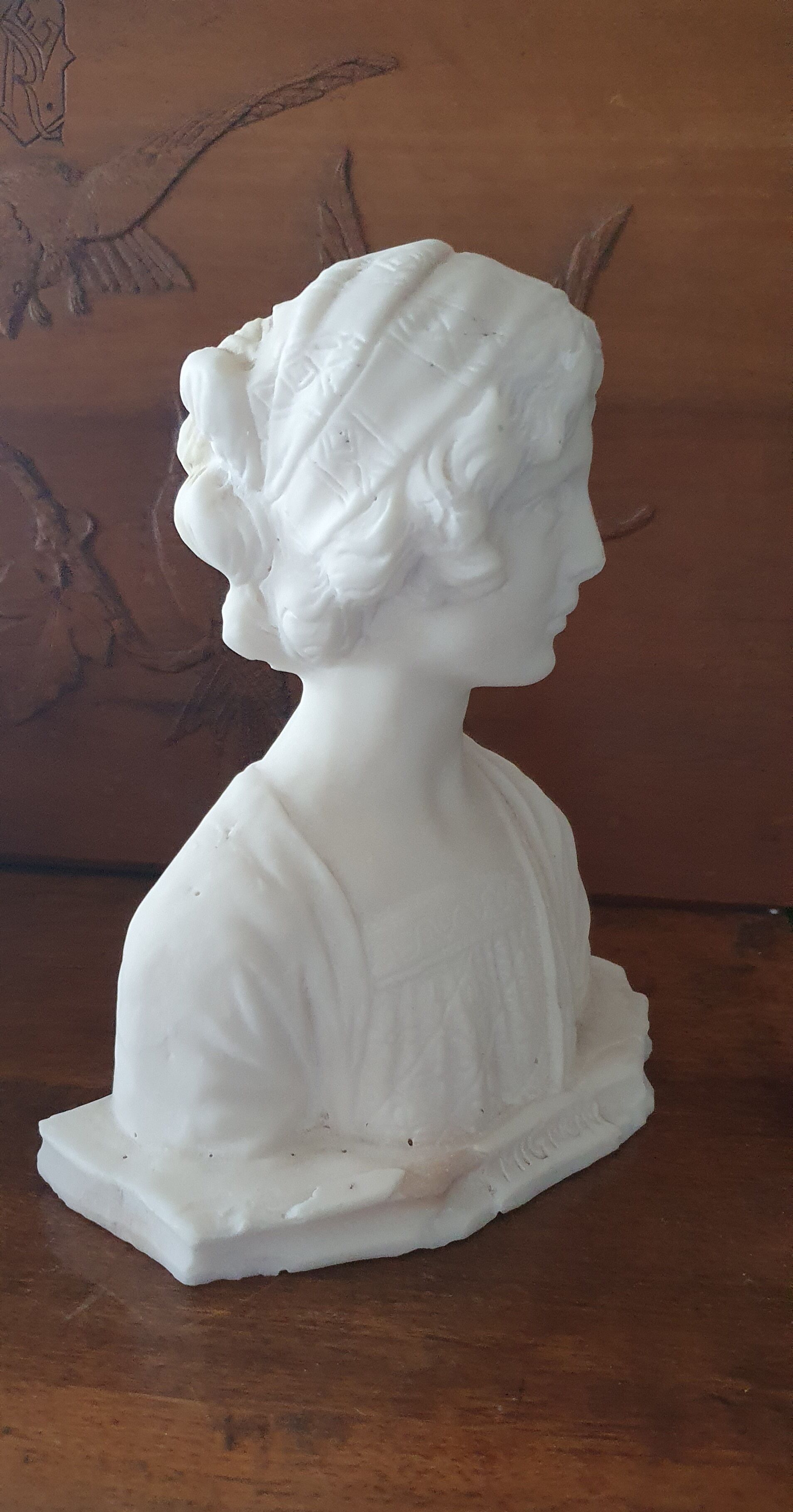 Bust of young woman L.Mignon