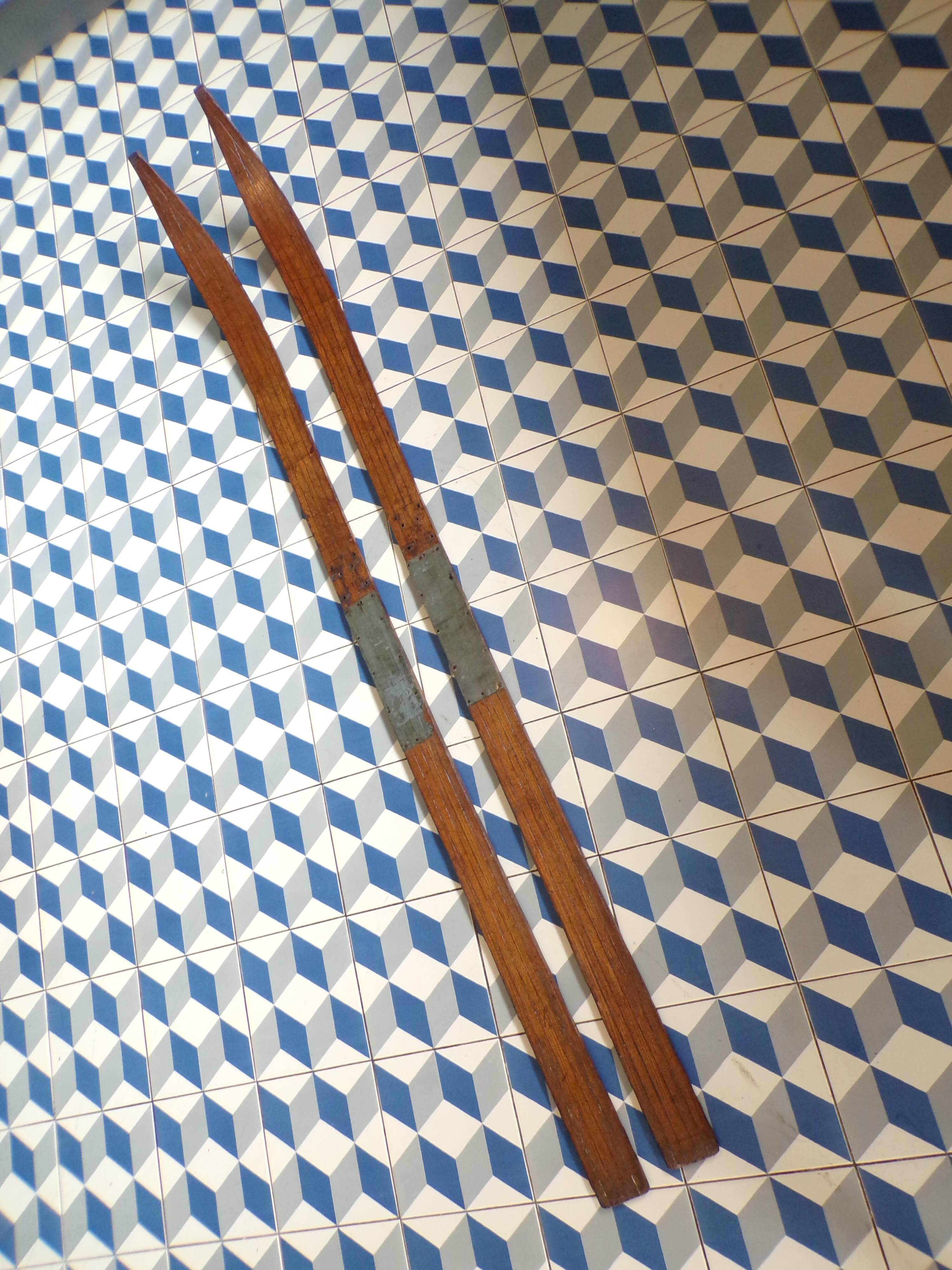 Pair of old wooden skis without bindings
