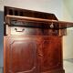 Antique mahogany secretary, upholstered flap and interior storage