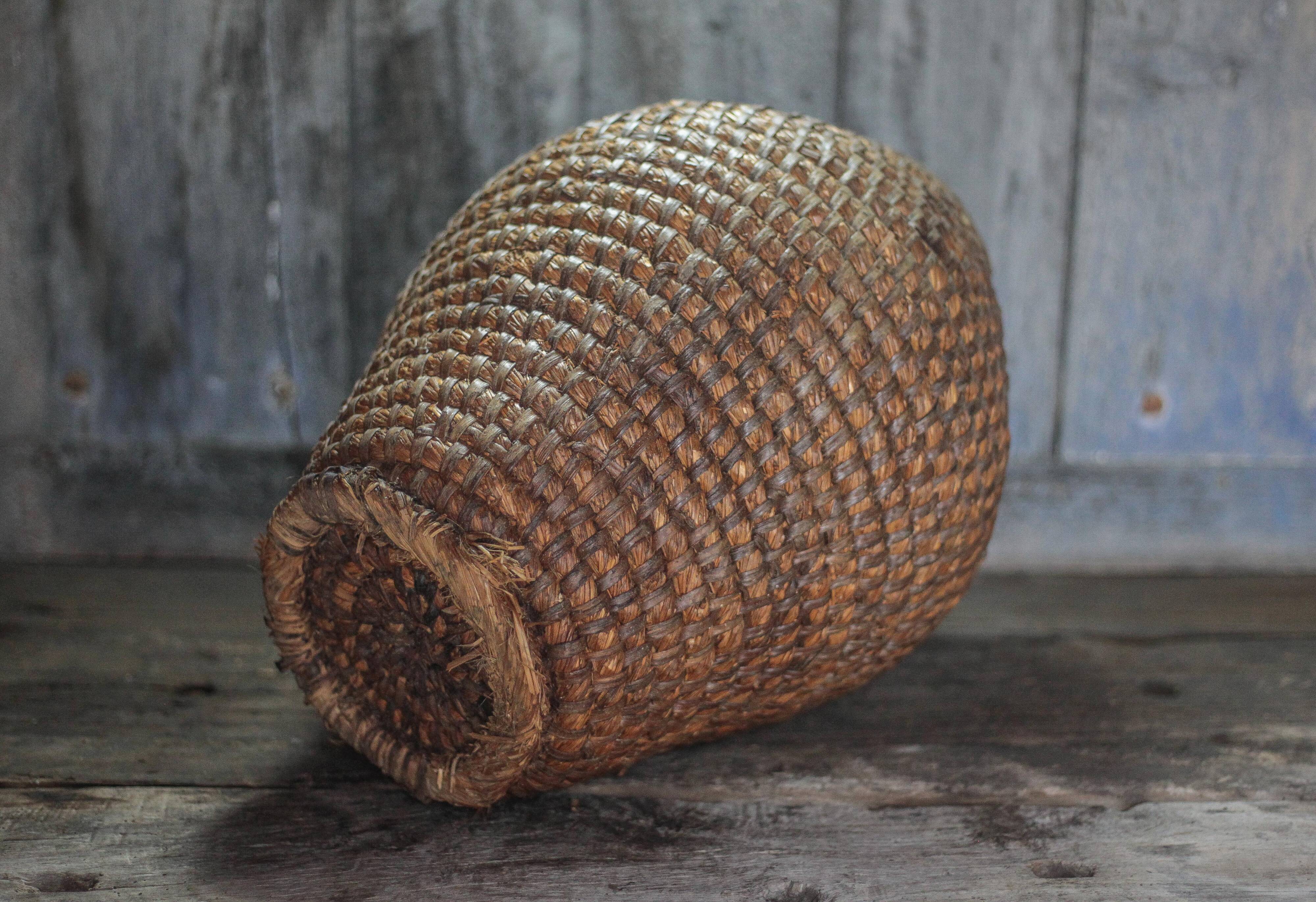 Old basket, straw and bramble bourgne, woven basket, interior decoration.