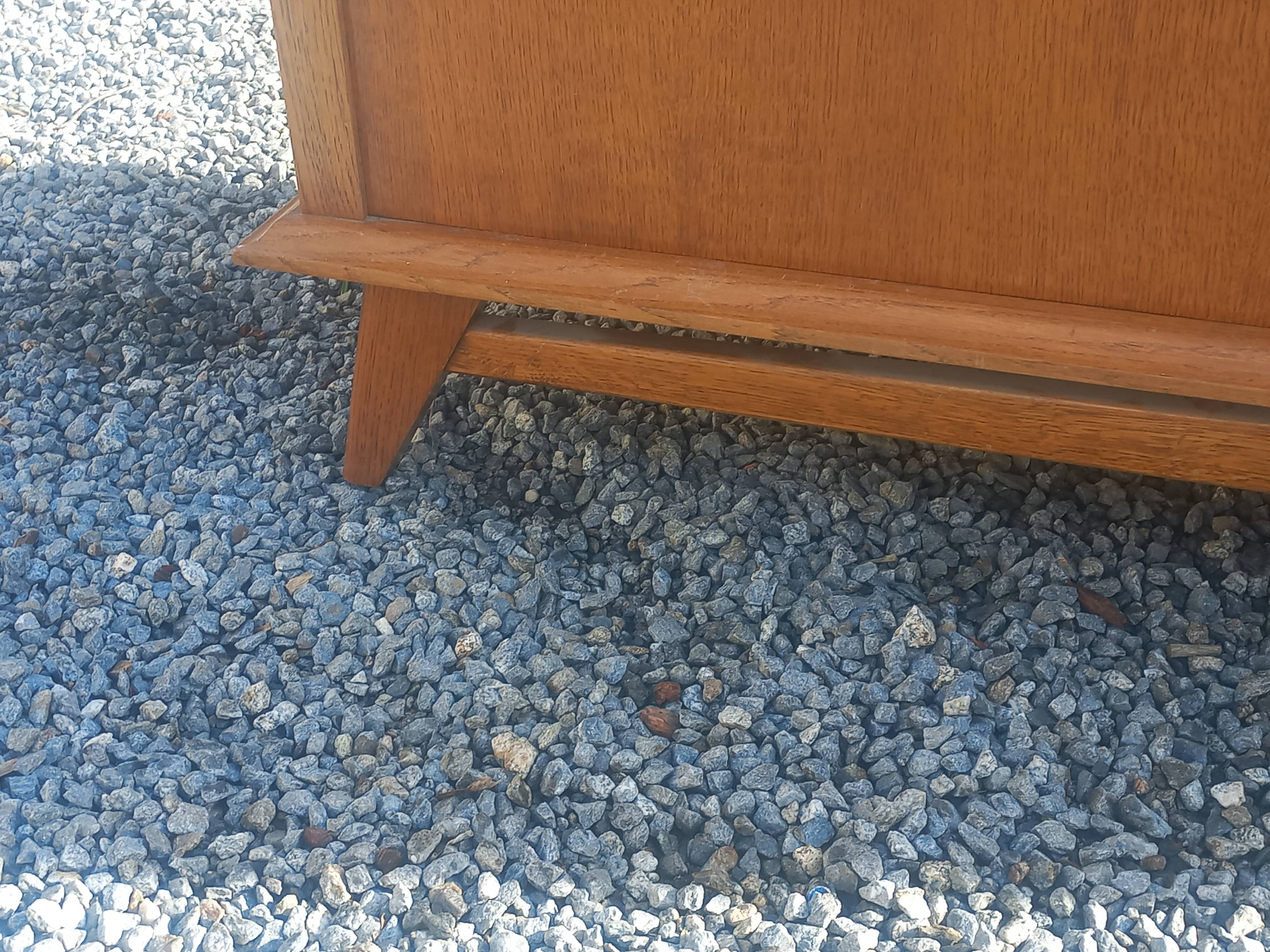 Vintage oak sideboard with splayed legs from the 1950s.