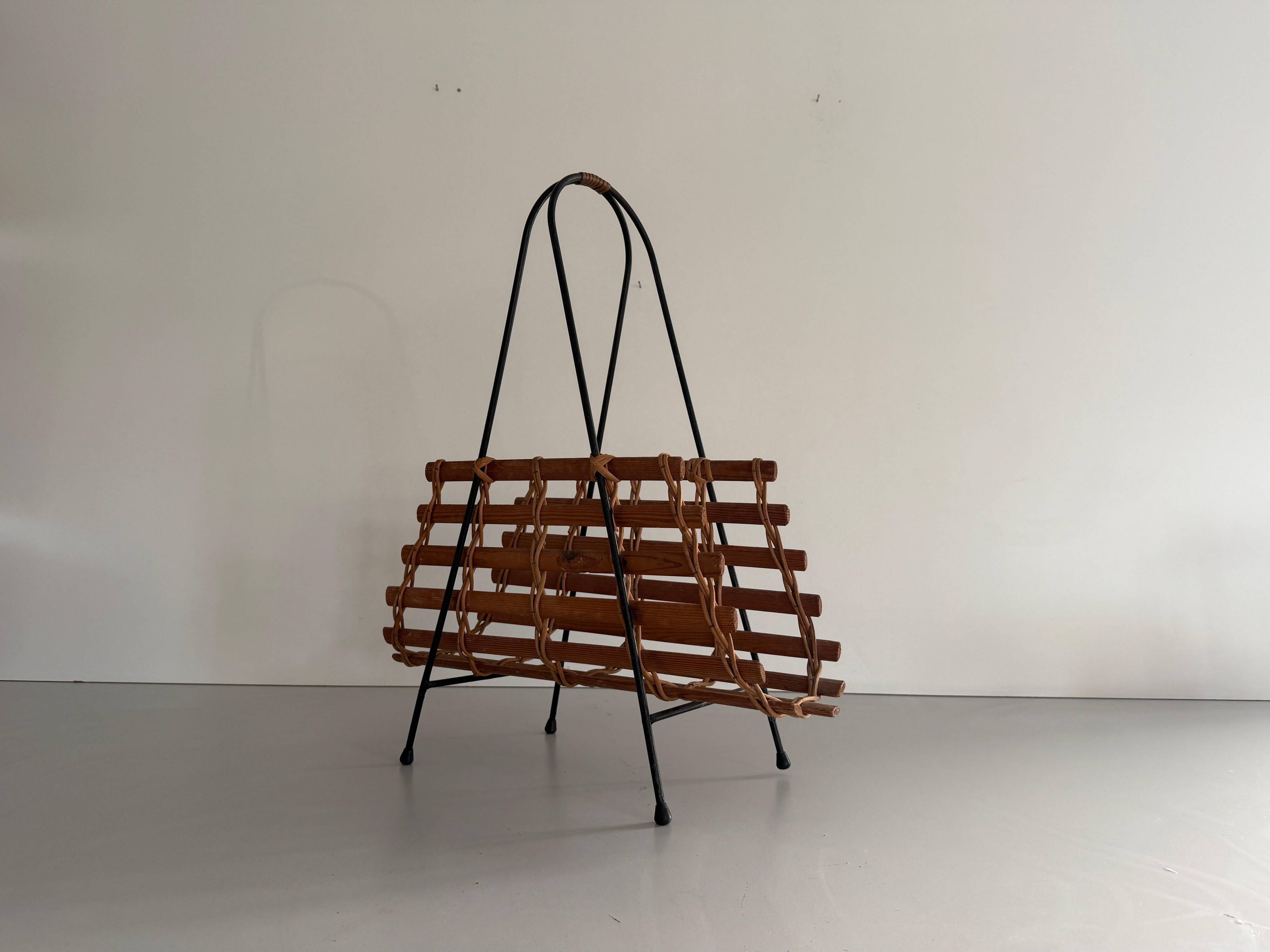 Mid-century black metal and wicker magazine rack, 1960, Germany