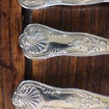 A set of 7 large metal shell spoons