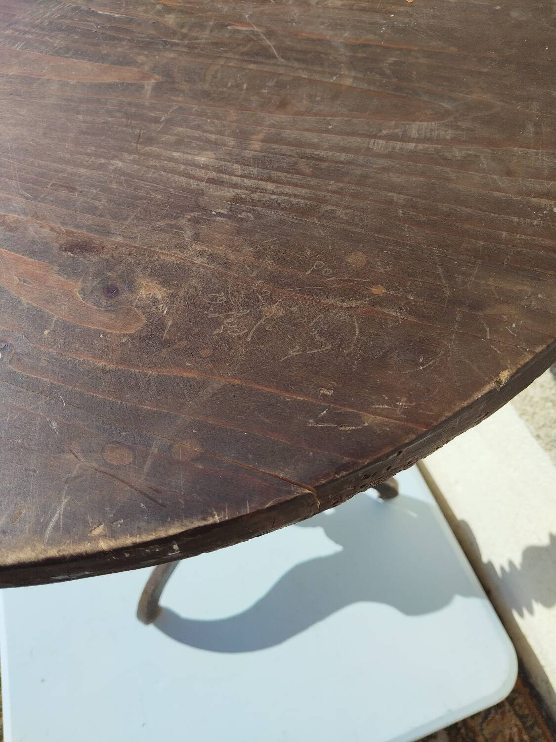 Small rustic antique tripod side table made of solid wood.