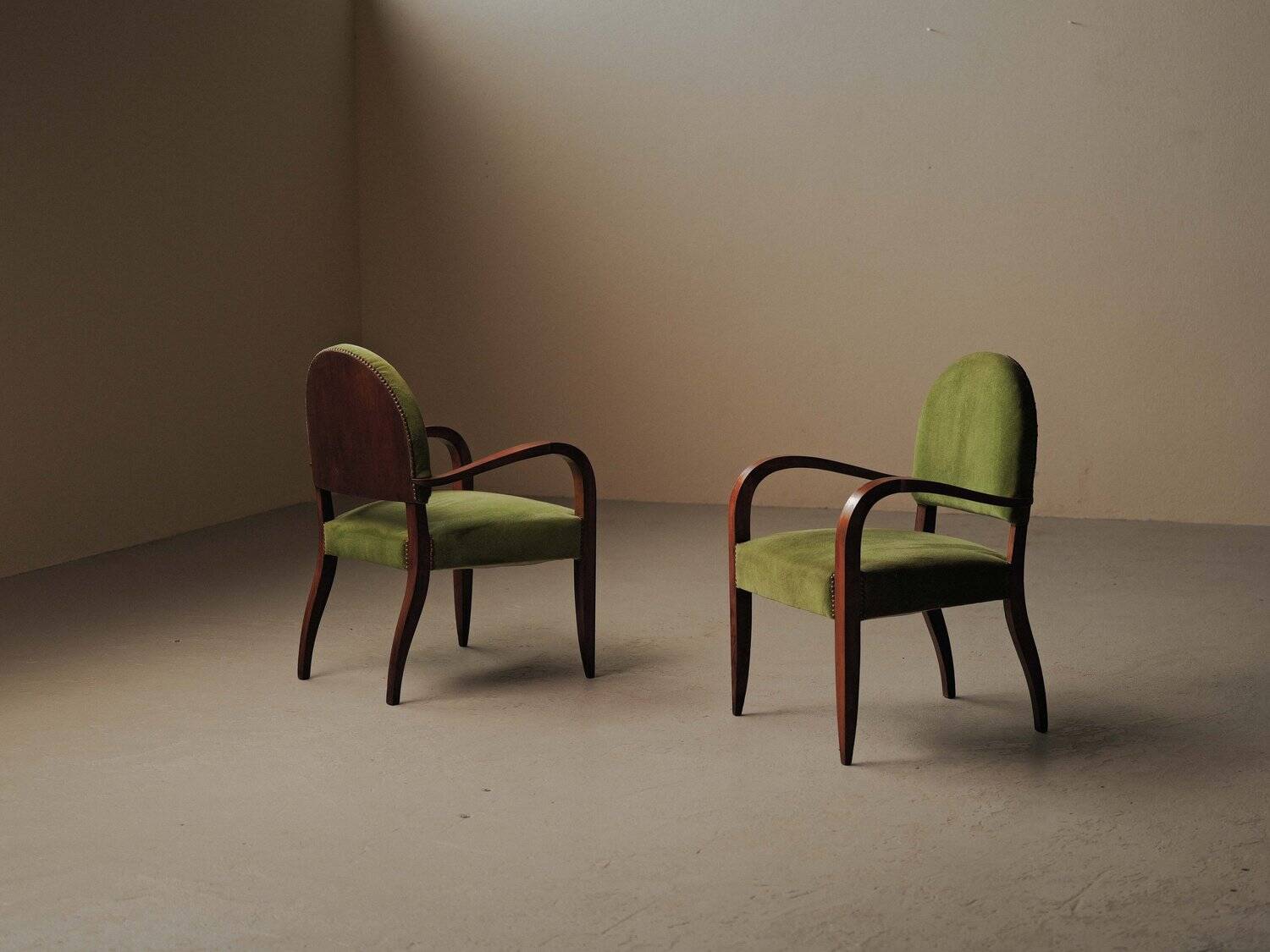 Pair of Art Deco armchairs in mahogany, circa 1930.