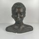 Female bust in neoclassical style in plaster by M. Mongey, 20th century.